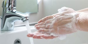 man-washing-hands-960x480